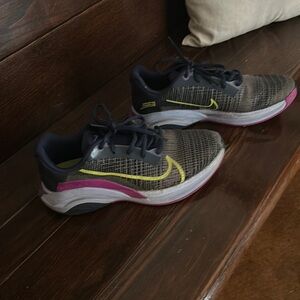 Nike superego athletic shoes. Navy blue, purple and lime green undertones.